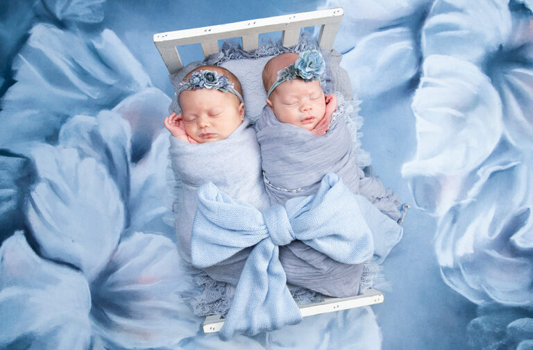 twins sleeping on a bed for newborn session in Virginia