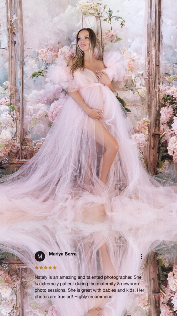Soft pink tulle gown maternity shoot among floral arch &ndash; client testimonial