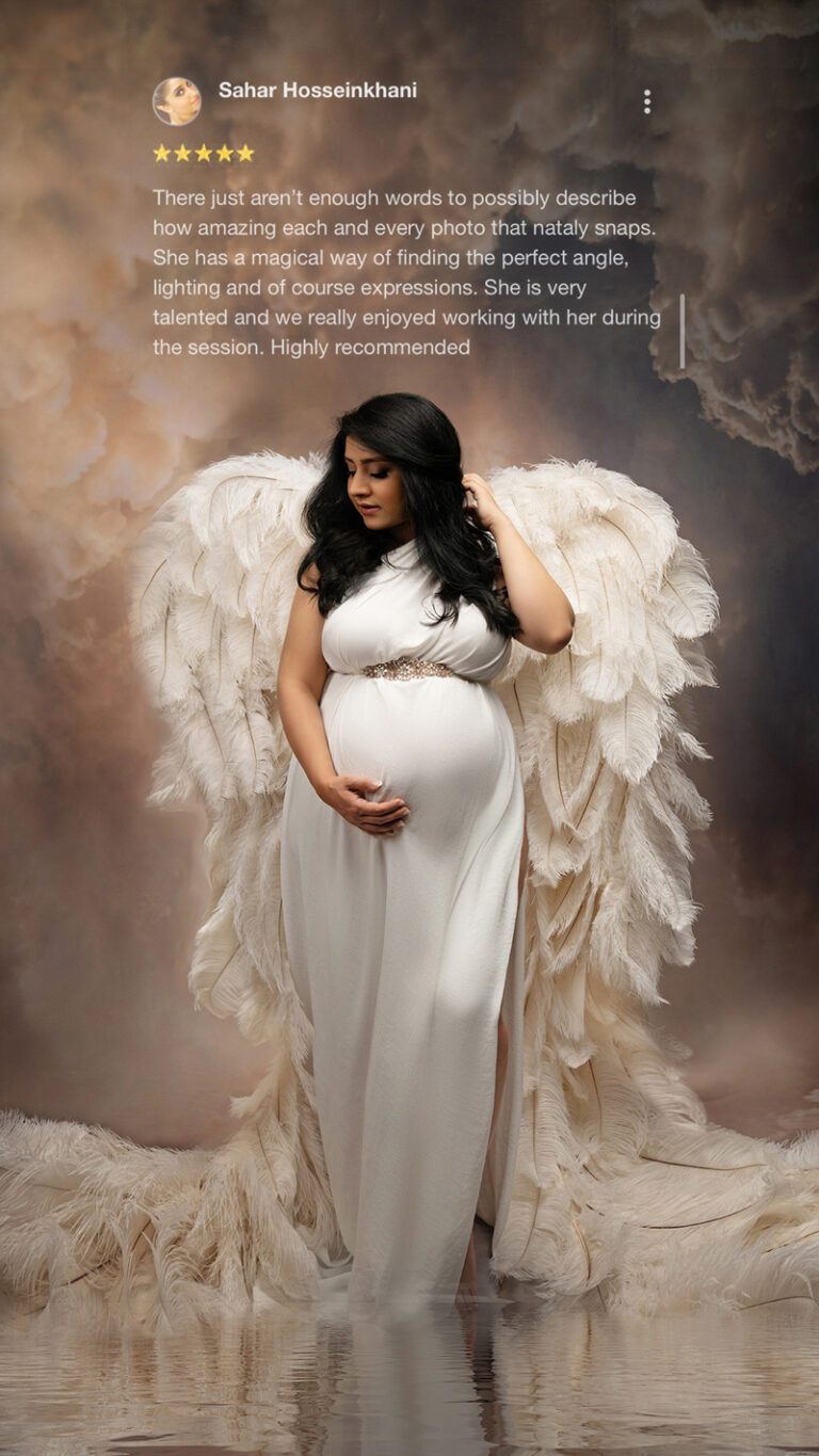 Maternity photo of woman in white angel gown with glowing wings and 5-star review overlay